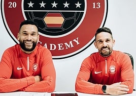 Caulker, left, at his presentation.