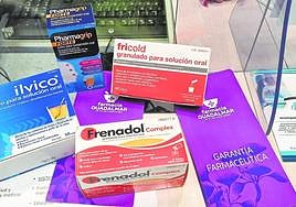 A collection of over-the-counter remedies for respiratory-tract illnesses at a Malaga pharmacy.