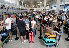 Passengers waiting for baggage check-in at Terminal 3.
