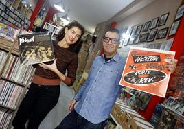 Guillermo Jiménez and Vivi Milla in Sleazy Records, the shop that has become their second home.