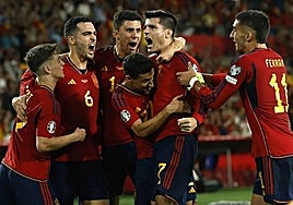 Spanish players celebrating their win over Scotland last October.