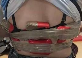 The packages of drugs strapped to the woman's body.