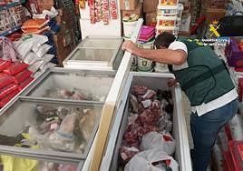 Freezer of horrors at Malaga takeaway: unpackaged chickens next to out-of-date meat
