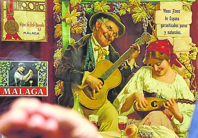 Beautiful old wine labels from bottles of Malaga wine exhibited in the centre.