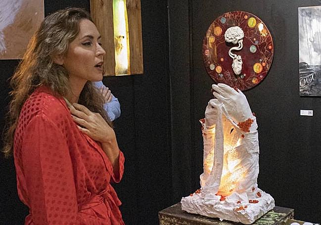 Syrie Jo Blanco Walsh, with her work that pays homage to those who could not receive treatment, due to the widespread collapse of health care.