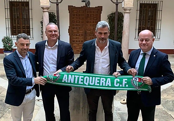 Garlick, second left, at the town's museum on Monday.