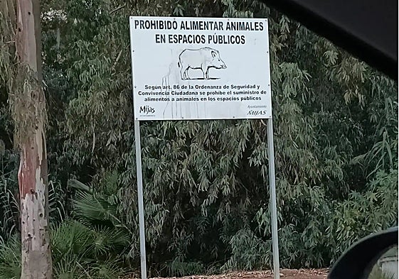 A sign warns people not to feed wild boar in a housing estate in Mijas