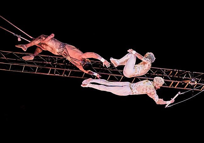 Ten acrobats on stage performing incredible leaps to reach the hands of their companions on the other side, ten metres above the ground.