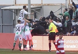 Antequera players celebrate scoring the winner.