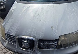 An image of the car covered in caustic soda.