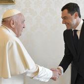 Pope Francis greets Juanma Moreno at the Vatican.