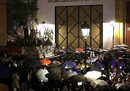 A rain-soaked procession on Palm Sunday.