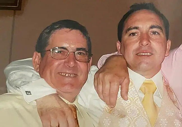 The convicted murderer and now victim of the assault, José García, with his son