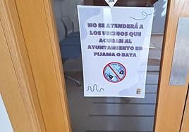 Sign in Marchal town hall prohibiting access in pyjamas or dressing gowns.