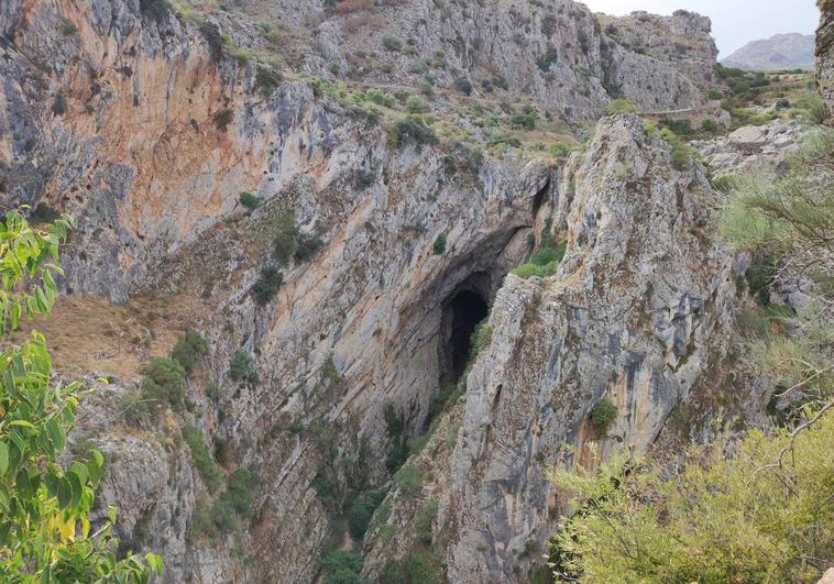 The Hundidero cave mouth from a nearby viewpoint (for scale note the roadway running just above it).v