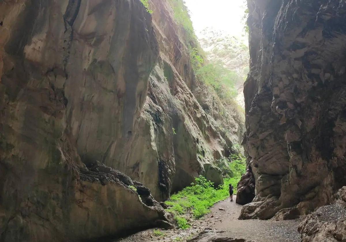 This is the spectacular cave near Ronda with an entrance standing over ...