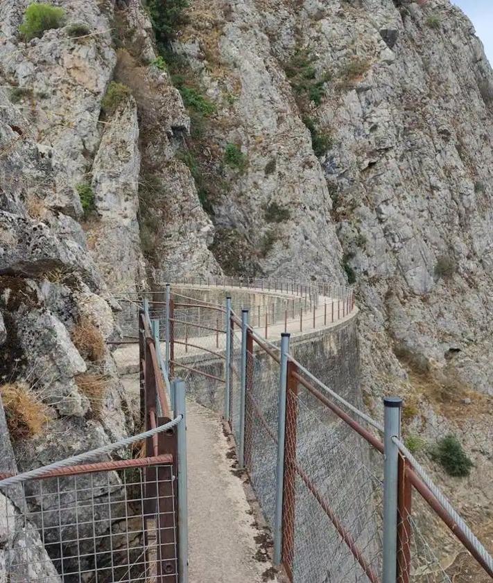 This is the spectacular cave near Ronda with an entrance standing over ...