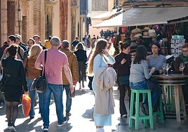 Tourists stroll through the historic centre of Malaga city.