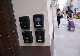 Key boxes of tourist flats in a street in Malaga.