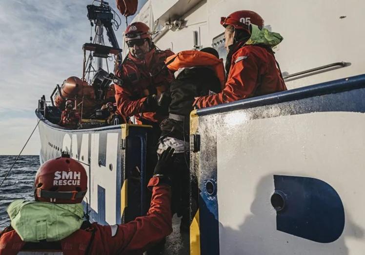 The moment when the rescued people are transferred to the boat, where they will be taken to a safe harbour.