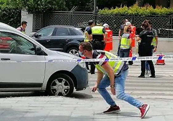 Police and medical staff at the scene of the crime.