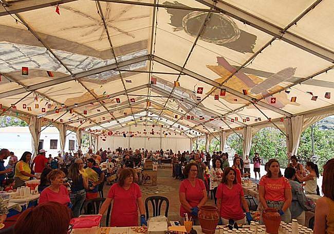 The meet-up is organised in a marquee at the entrance of Almáchar.