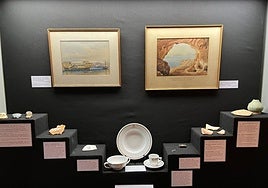 Watercolour paintings of the HMS Owen Glendower by James Lewis Holloway (l) and of Beefsteak Cave by Frederick Leeds Edridge (r).