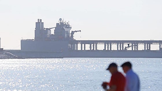 What is the distinctive US Navy ship moored at Malaga port this week?