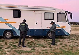 Guardia Civil officers in action, evicting some of the owners of motorhomes.