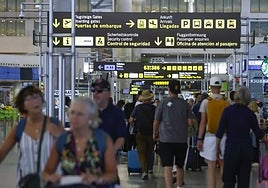 Busy departures hall at Malaga Airport T3.