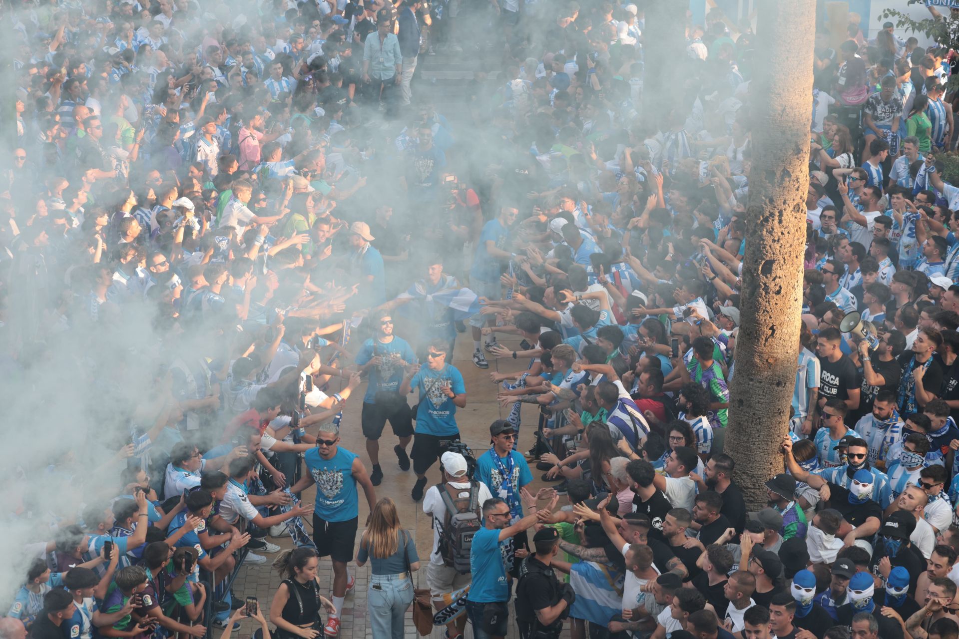 Fans celebrate Malaga CF's promotion as squad take open-top bus tour, in images
