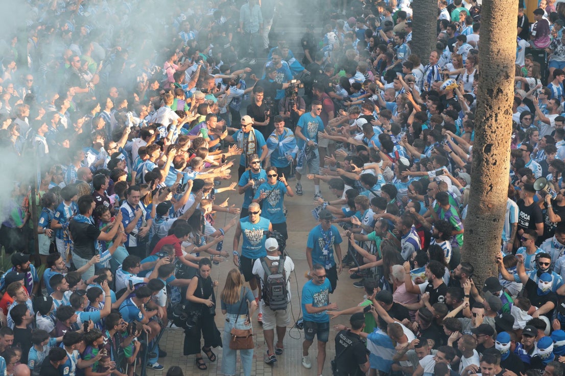 Fans celebrate Malaga CF's promotion as squad take open-top bus tour, in images