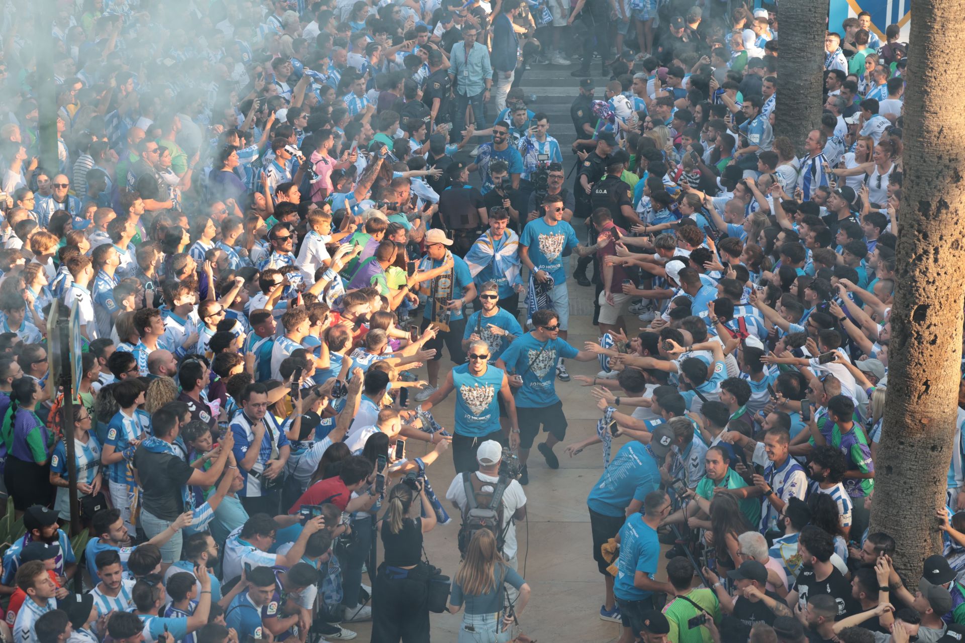 Fans celebrate Malaga CF's promotion as squad take open-top bus tour, in images