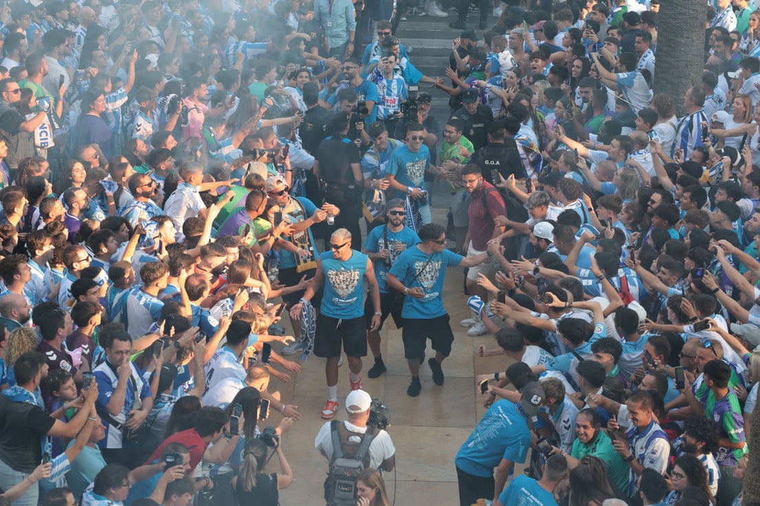 Fans celebrate Malaga CF's promotion as squad take open-top bus tour, in images