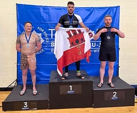 PC Danino on the podium with his gold medal.