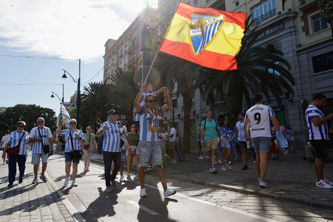 Fans celebrate Malaga CF's promotion as squad take open-top bus tour, in images