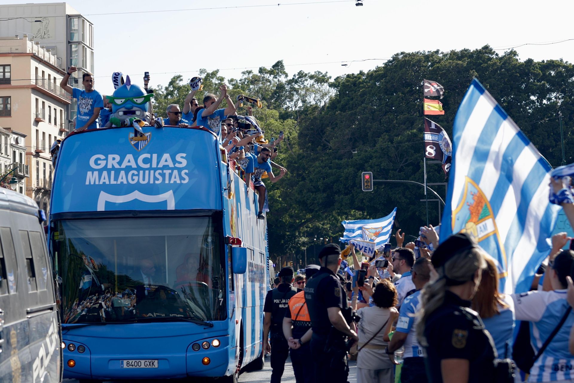 Fans celebrate Malaga CF's promotion as squad take open-top bus tour, in images