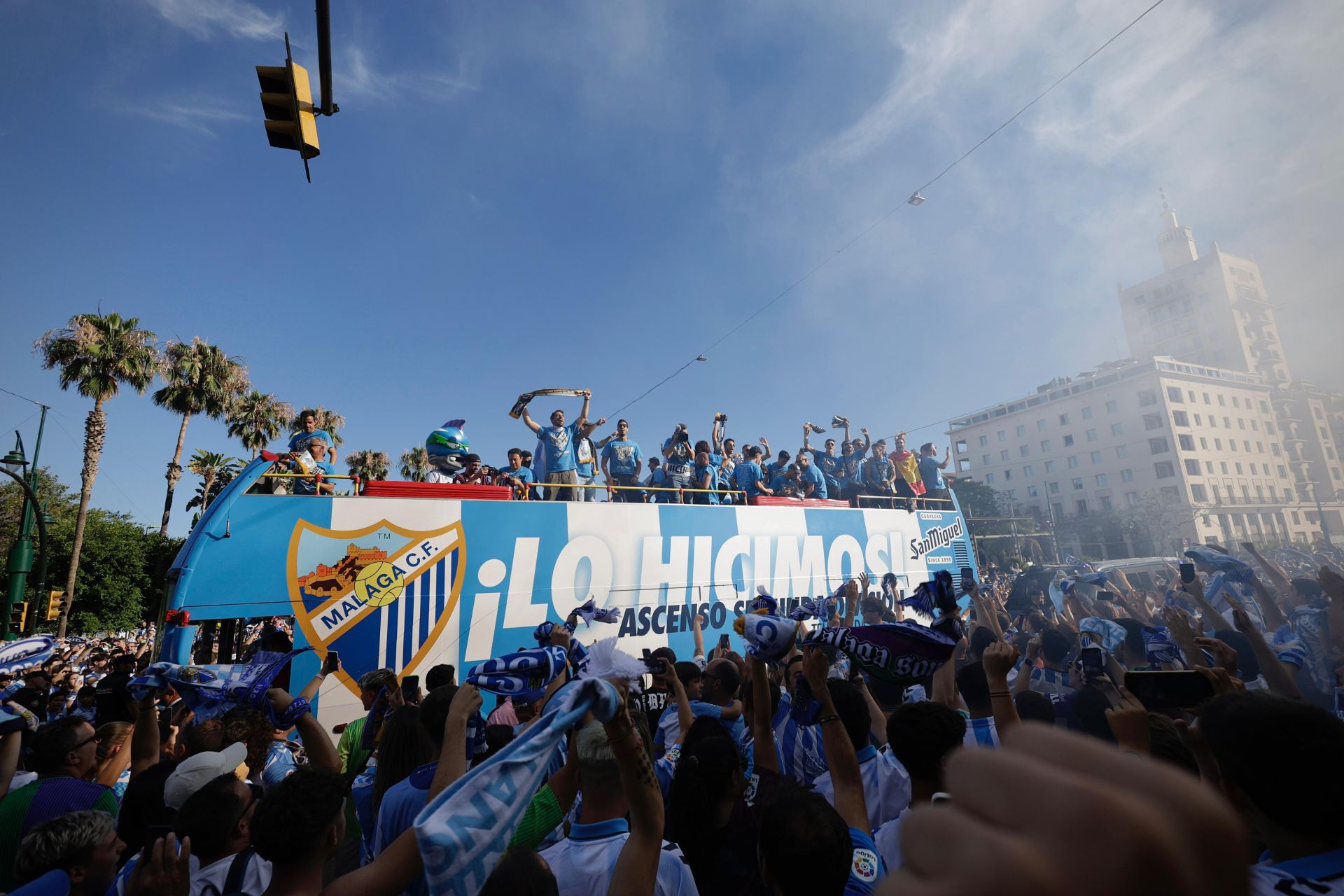 Fans celebrate Malaga CF's promotion as squad take open-top bus tour, in images