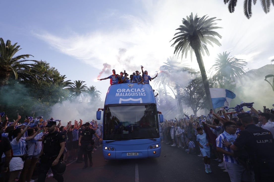 Fans celebrate Malaga CF's promotion as squad take open-top bus tour, in images