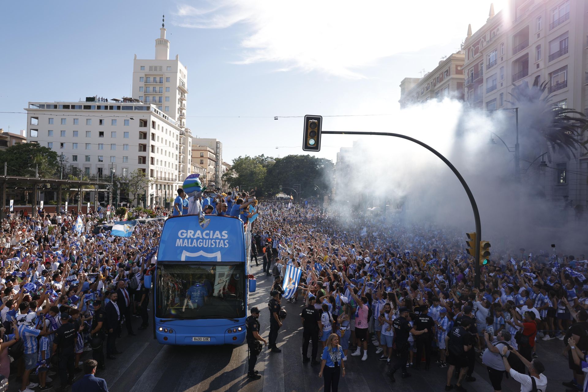Fans celebrate Malaga CF's promotion as squad take open-top bus tour, in images