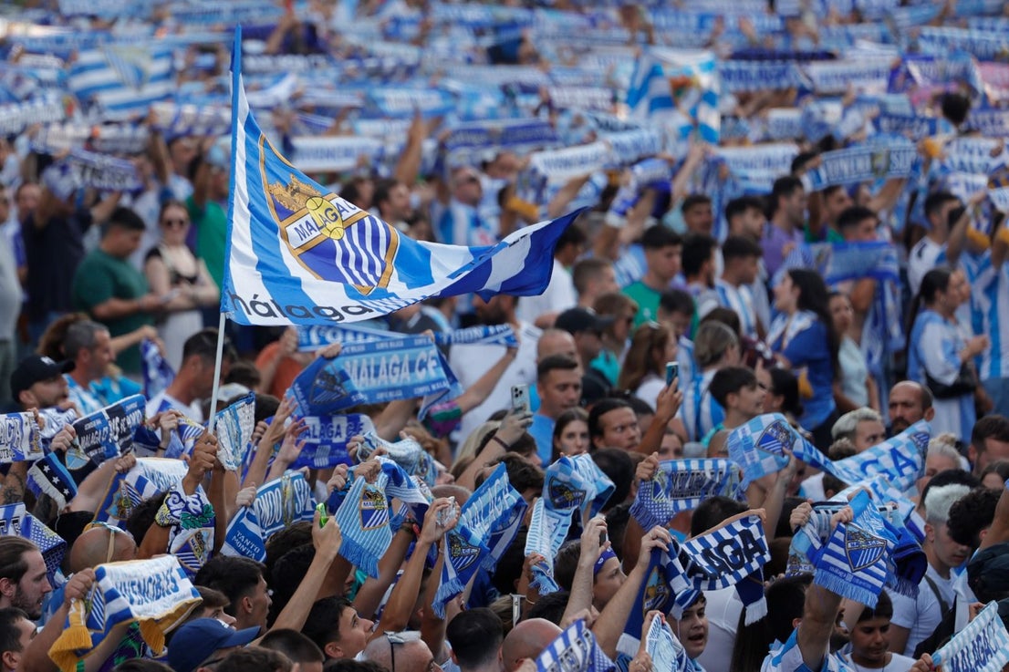 Fans celebrate Malaga CF's promotion as squad take open-top bus tour, in images