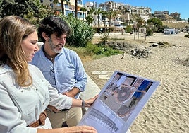 Councillors study the plans of the new section of coastal path.