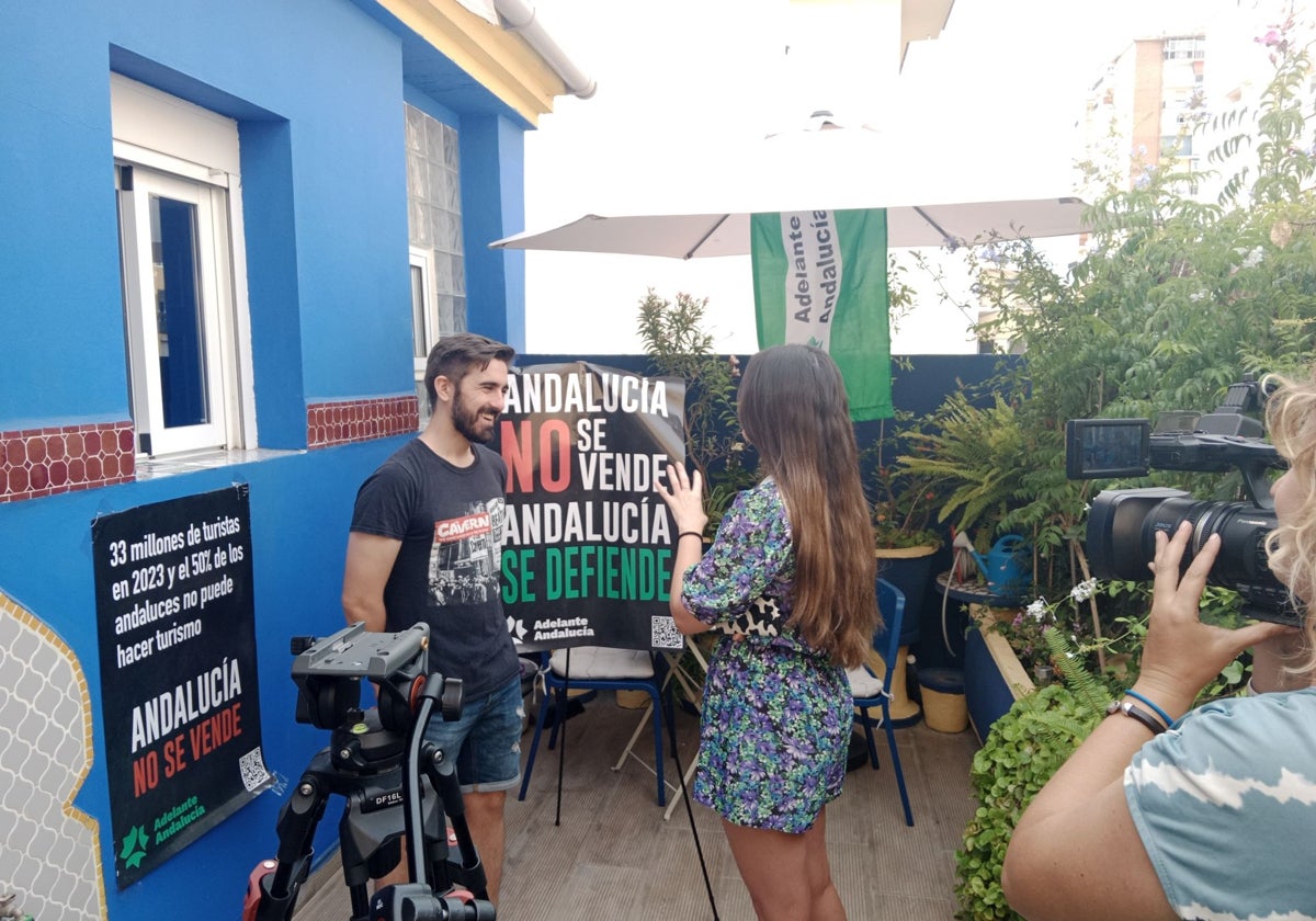 Luis Rodrigo, presents his campaign outside a tourist property in Malaga city.