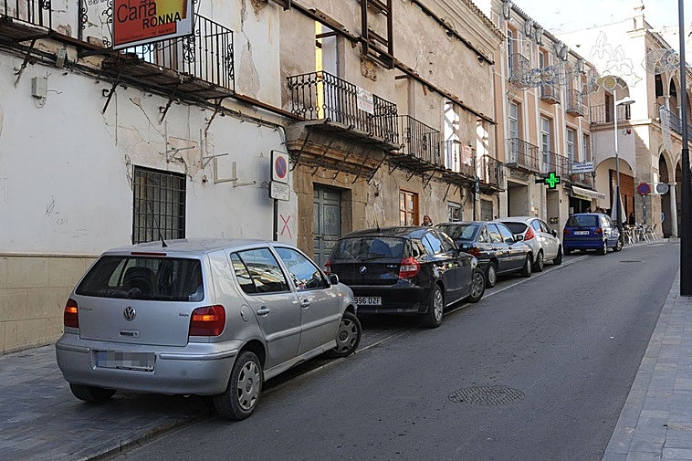 Cars parked on the pavement.