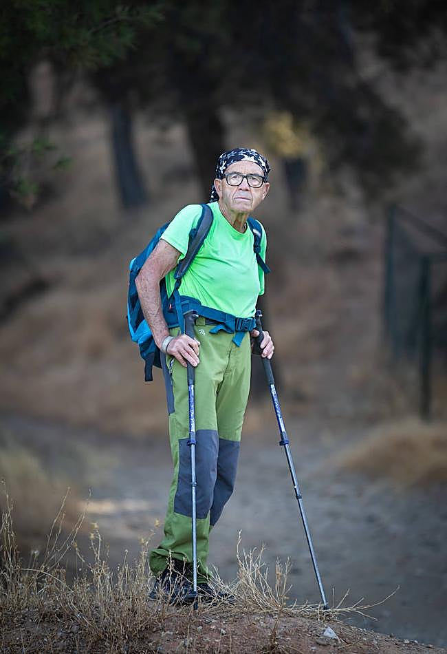 Paco, with his walking sticks and headscarf.