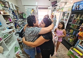 Maria says goodbye to one of her customers on the last day of opening to the public.