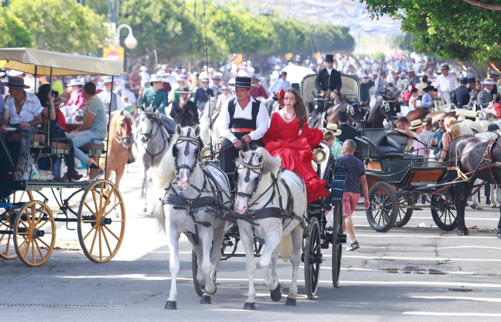 The outfits worn by men, and some women, include the traditional Cordoba wide-brimmed hat.