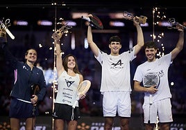 The winning pairs celebrate on the podium.