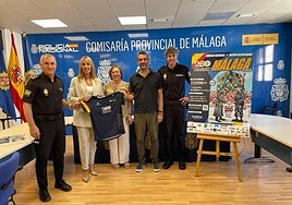 The National Police, the head of Banco Santander and the president of AMSA at the presentation for the poster campaign.