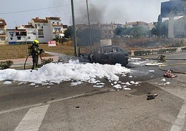 Firefighters extinguishing the flames on Monday in Torre del Mar.